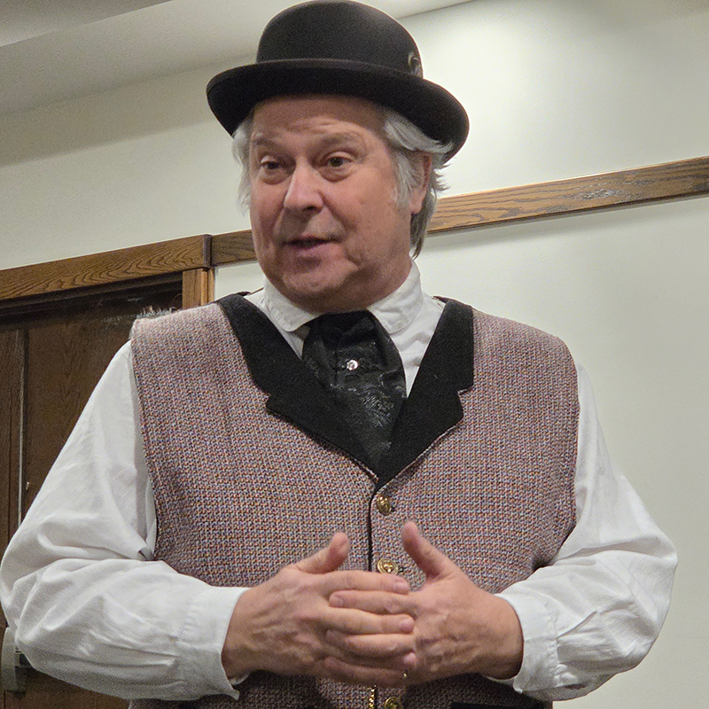 Fox Ellis performing as Charles Darwin